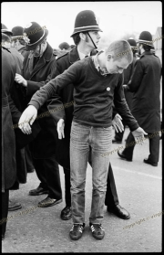 Young demonstrator being searched by police at Anti-NF demo