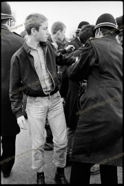 Young demonstrator being searched by police at Anti-NF demo