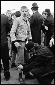 Skinhead demonstrator serched by Police at Anti-NF demo